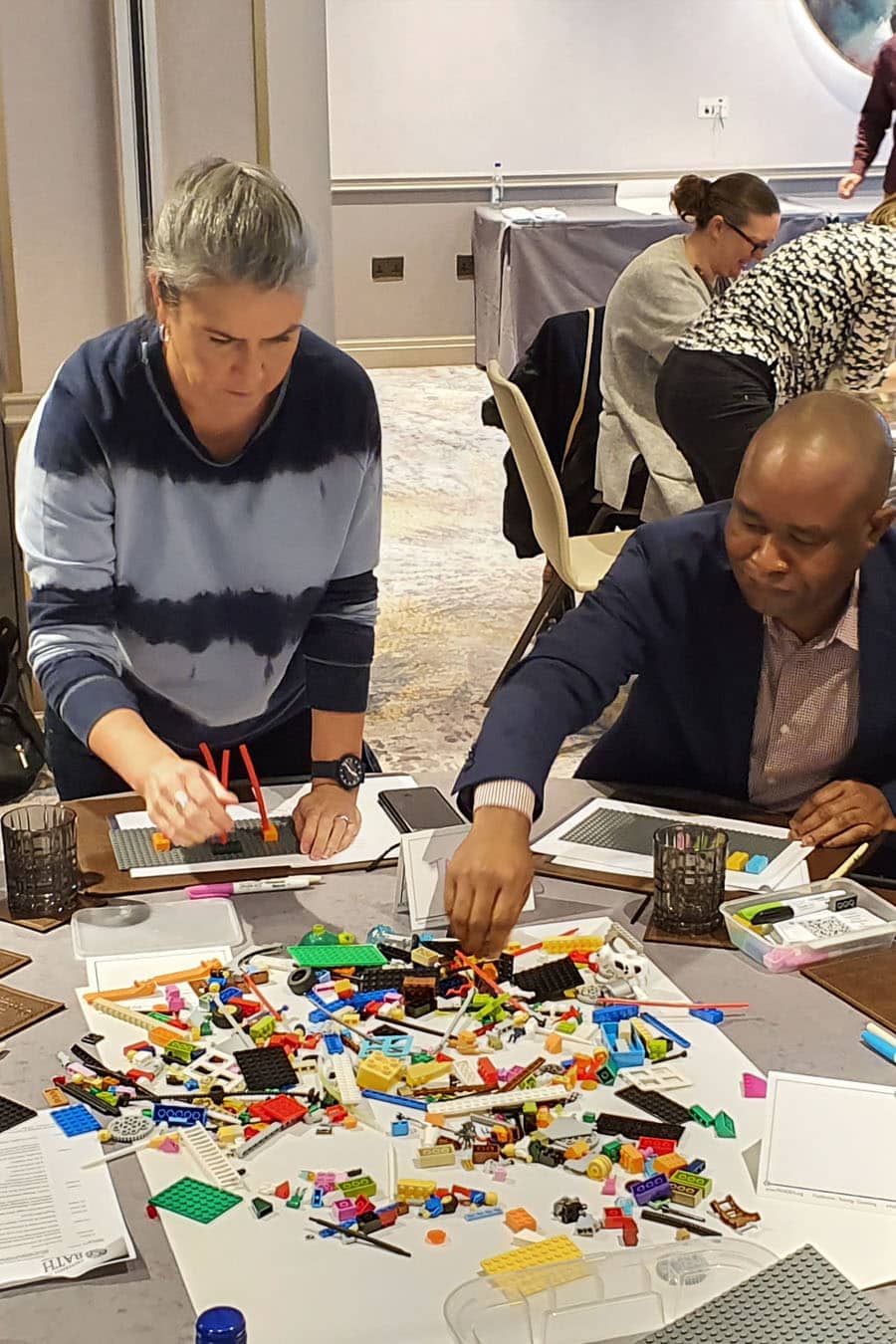 Man and a woman working on problem solving with LEGO Serious Play