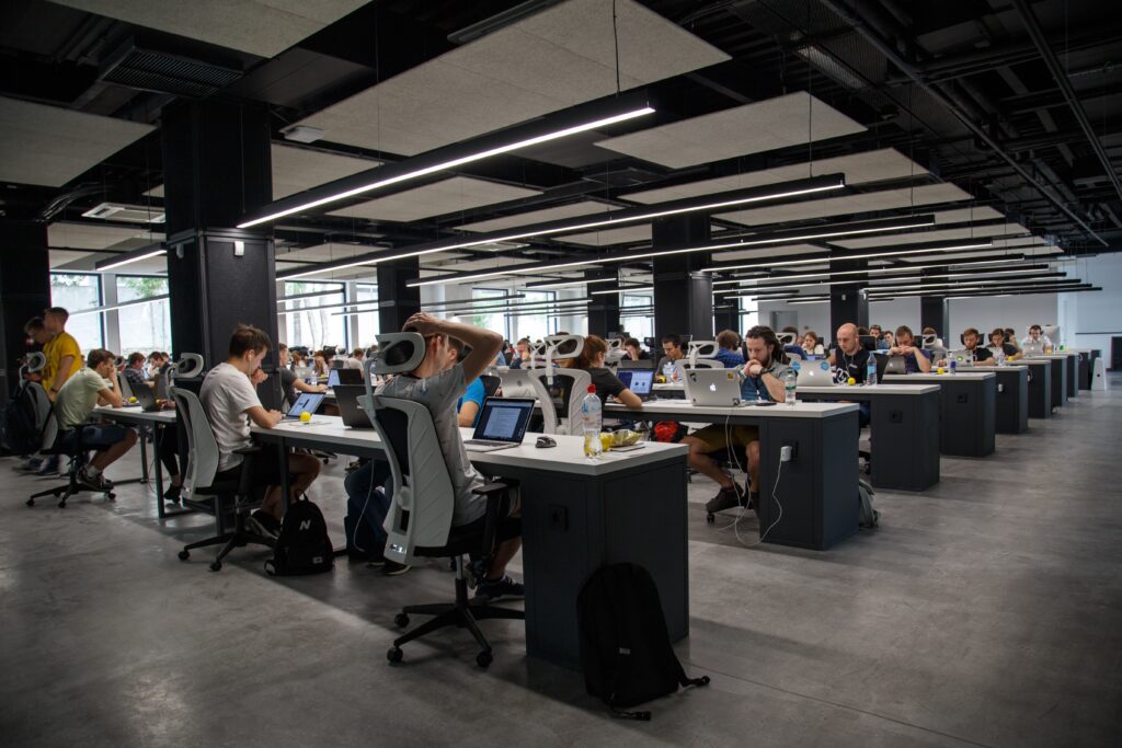 An open plan office with many people working at desks